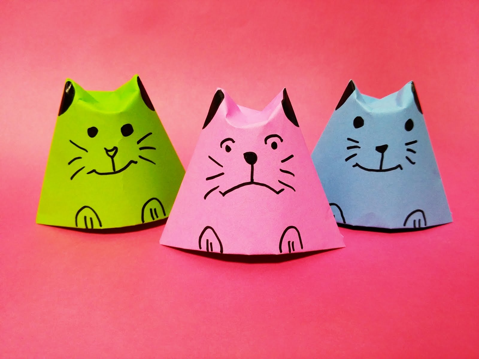 An image of three simple origami cats